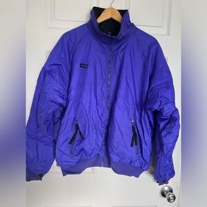 Vintage Columbia reversible purple/black puffer skin jacket.  Size large.